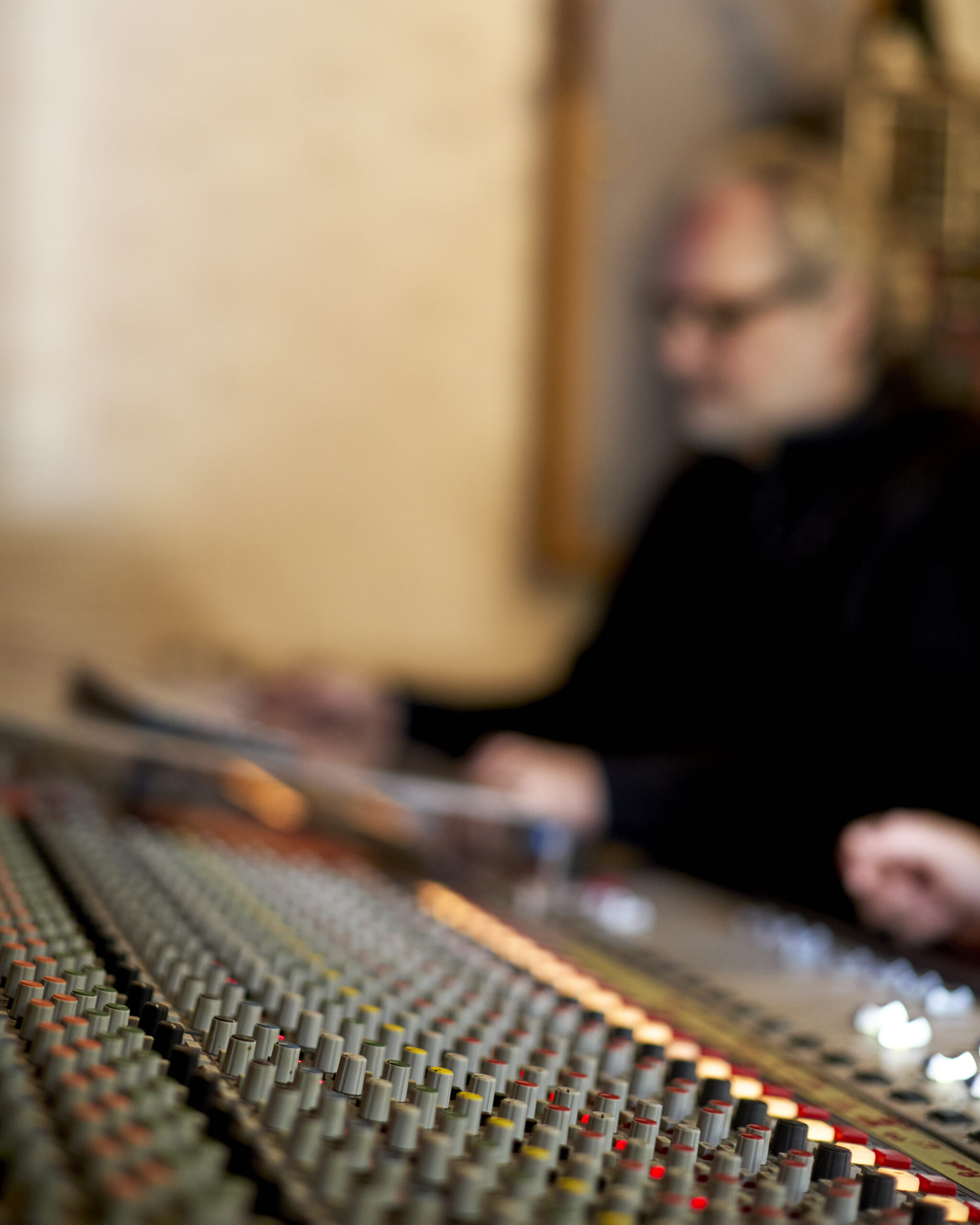 Production music and sync licensing shown in video editing timeline with audio waveform